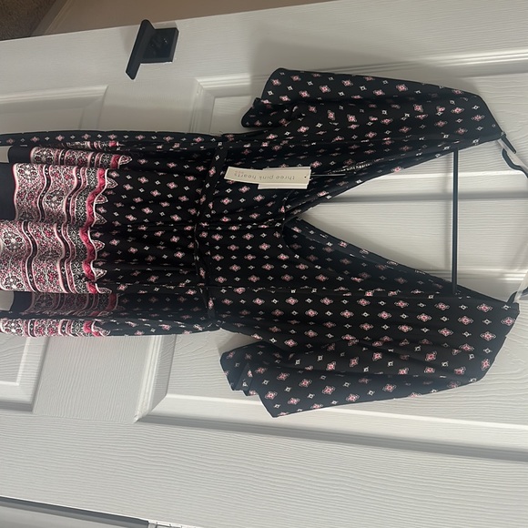 New. Never worn romper. With tags - Picture 2 of 3